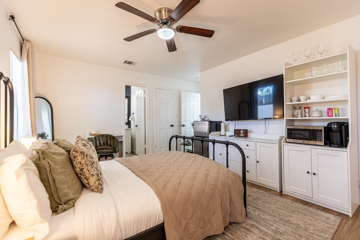 2012 Balsam Way Round Rock, TX 78665 - Photo 23 of 30 Bedroom with ceiling fan and light wood-type flooring