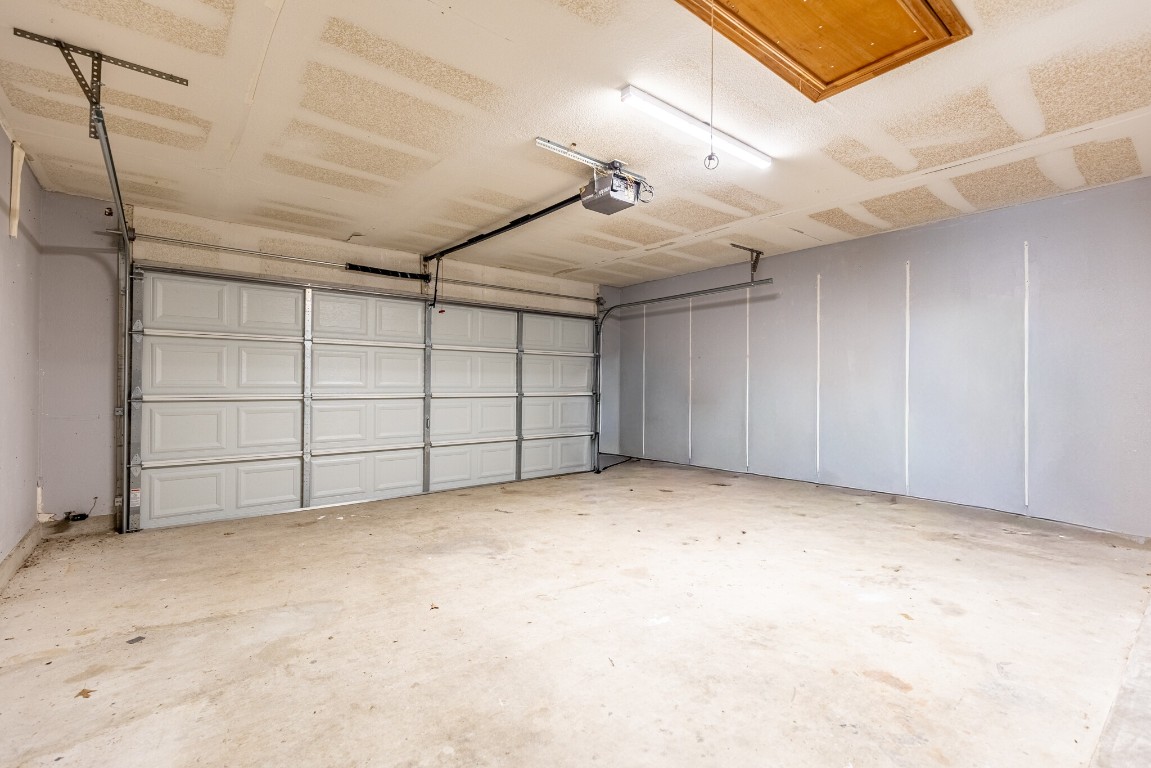 2012 Balsam Way Round Rock, TX 78665 - Photo 26 of 30 Garage featuring a garage door opener