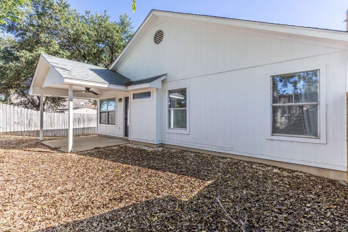 2012 Balsam Way Round Rock, TX 78665 - Photo 28 of 30 Back of house with ceiling fan, a patio, and roof with shingles