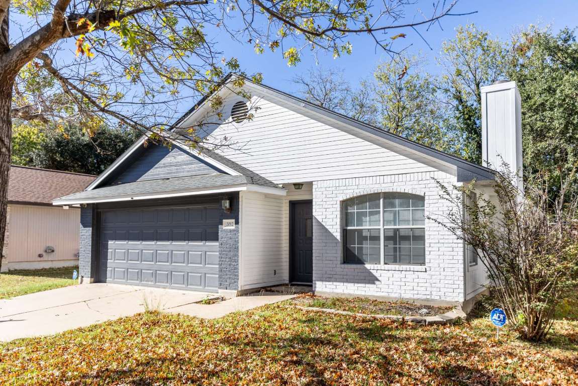 2012 Balsam Way Round Rock, TX 78665 - Photo 3 of 30 View of front of property with concrete driveway, brick siding, and a garage