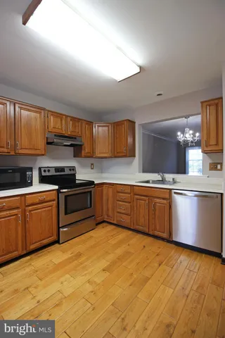 outdoor kitchen with stainless steel appliances granite countertop a stove a sink dishwasher and a microwave oven on the blue kitchen countertops