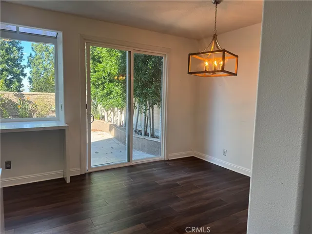 a bathroom with a granite countertop sink and mirror