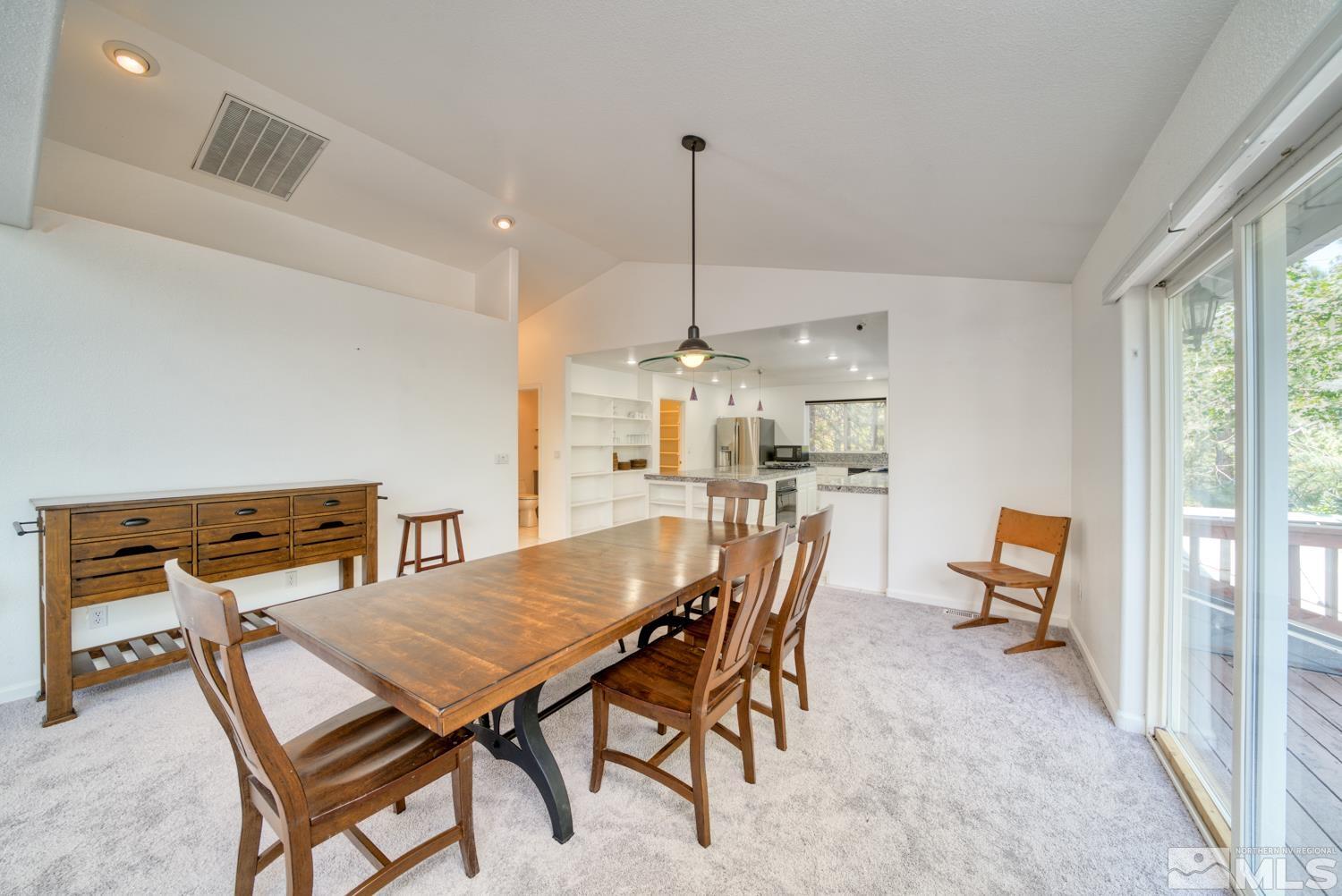 50 Sunridge Drive Reno, NV 89511 - Photo 11 of 30 a dining room with furniture and a floor to ceiling window
