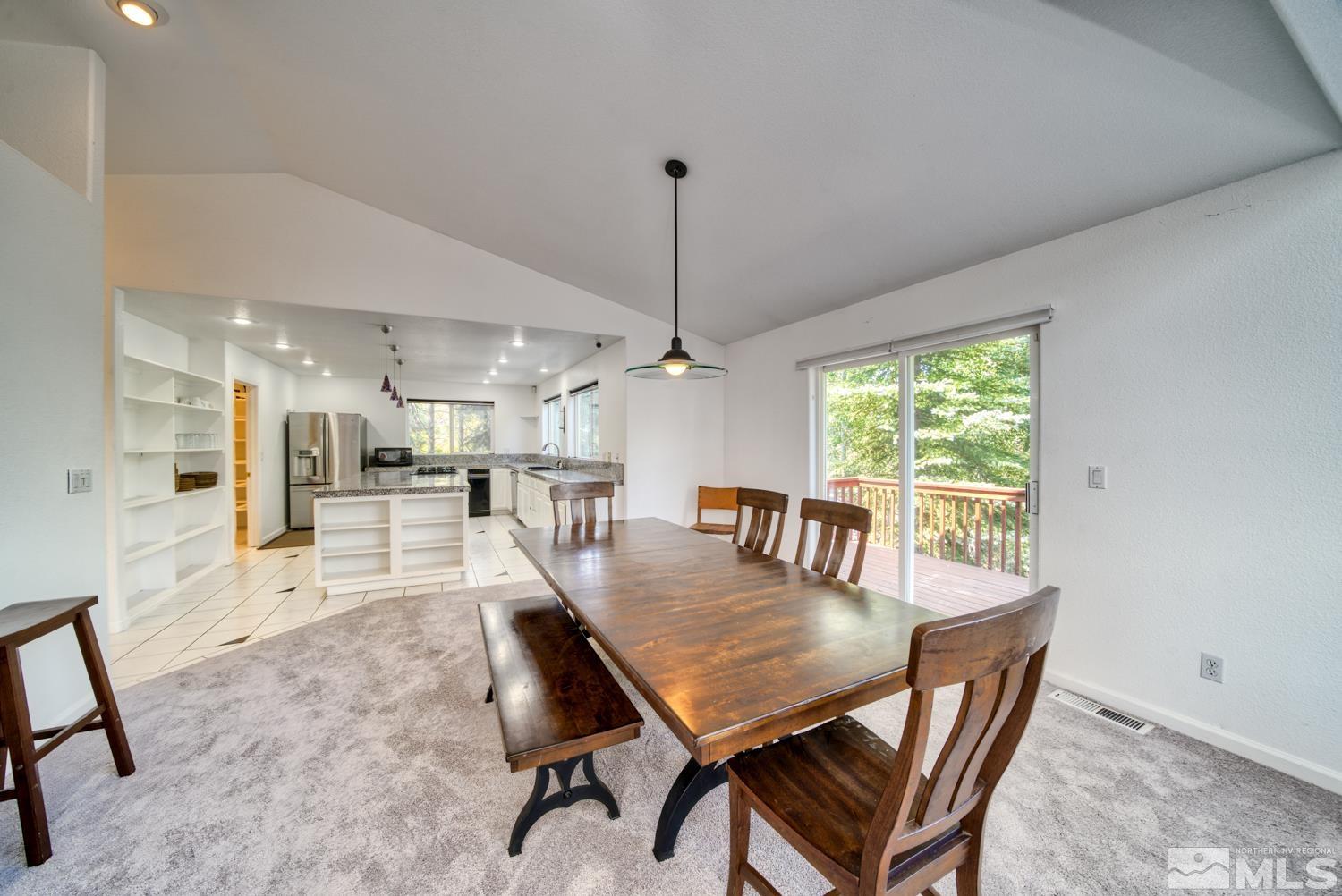 50 Sunridge Drive Reno, NV 89511 - Photo 12 of 30 a view of a dining room with furniture window and wooden floor