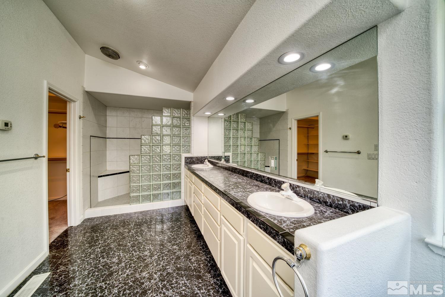 50 Sunridge Drive Reno, NV 89511 - Photo 16 of 30 a kitchen with granite countertop a sink and a refrigerator