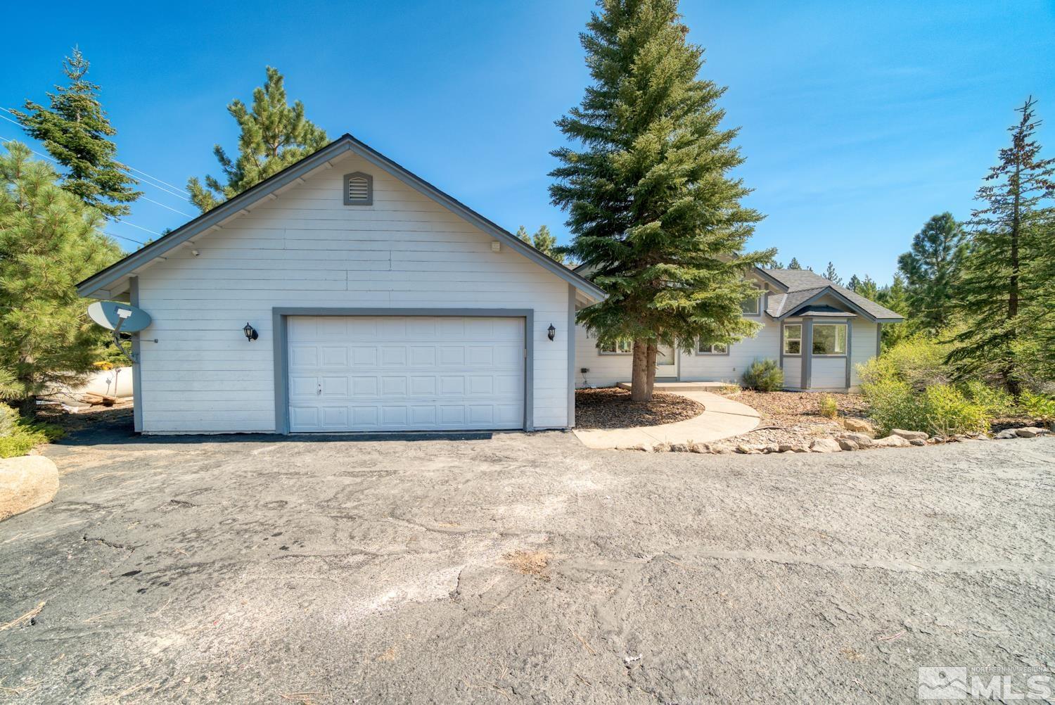 50 Sunridge Drive Reno, NV 89511 - Photo 30 of 30 a front view of a house with a yard and garage