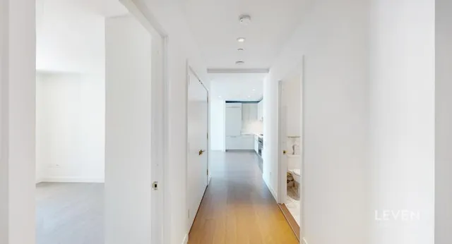 a view of a hallway with a white walls