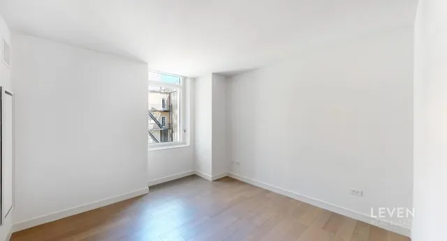 a view of an empty room and window