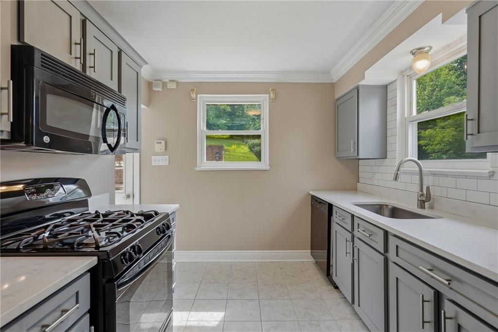 809 Franklin Road Mars, PA 16046 - Photo 15 of 44 Updated kitchen with quartz counters and black appliances
