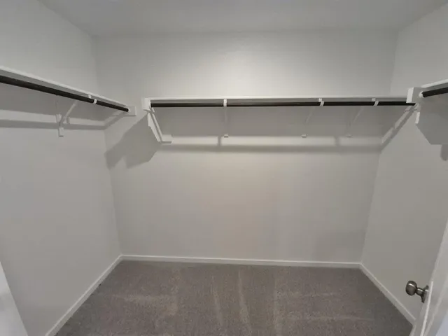 a view of an empty walk in closet