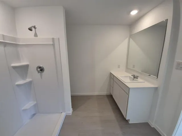 a bathroom with a sink and mirror