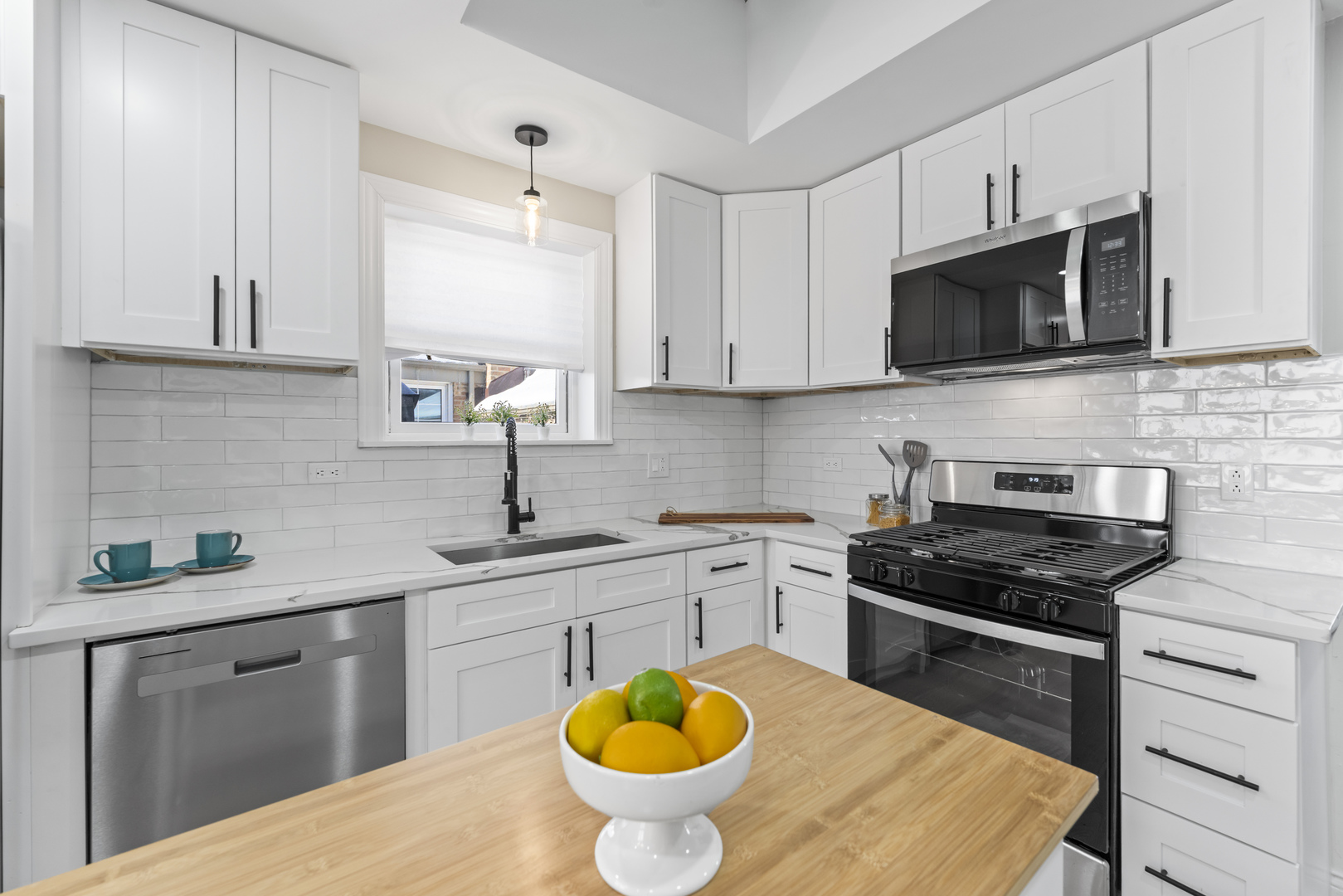 8169 South Tripp Avenue Chicago, IL 60652 - Photo 11 of 31 a kitchen with a sink stove and microwave