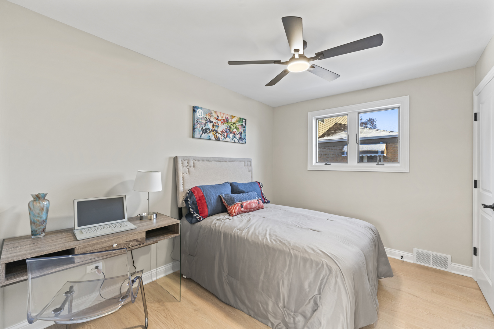 8169 South Tripp Avenue Chicago, IL 60652 - Photo 18 of 31 a bedroom with a bed and a table in it