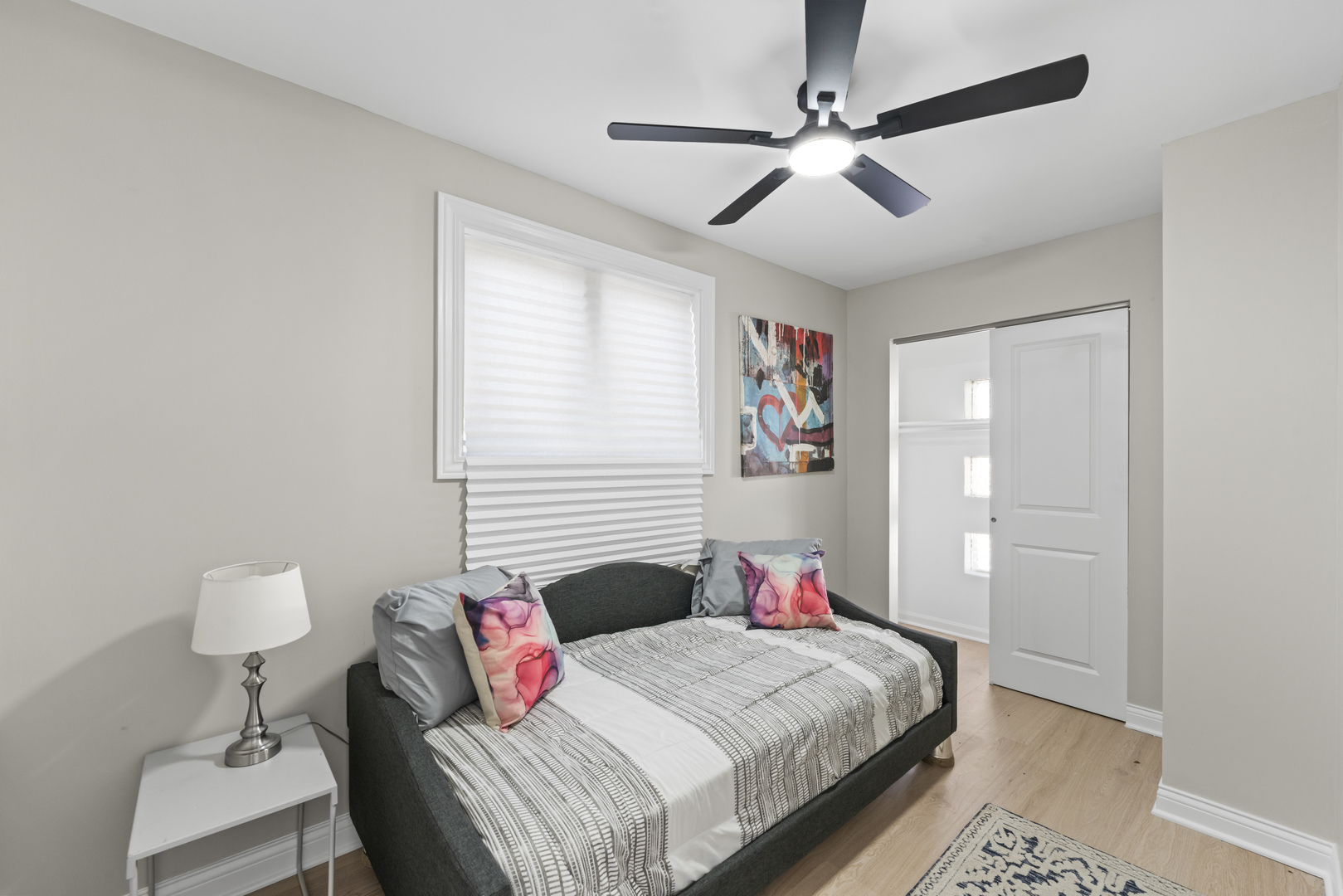 8169 South Tripp Avenue Chicago, IL 60652 - Photo 20 of 31 a bedroom with a bed and a chandelier