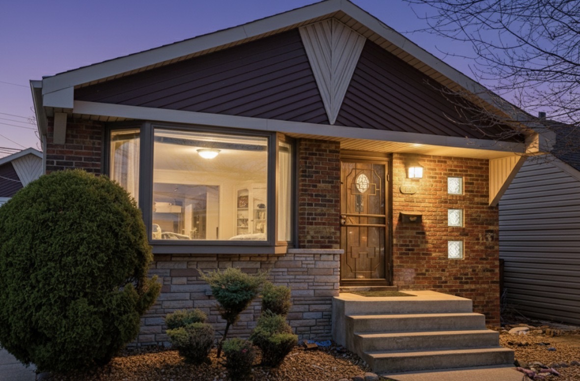8169 South Tripp Avenue Chicago, IL 60652 - Photo 2 of 31 a front view of a house with a yard