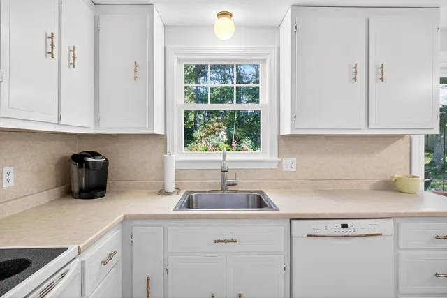 a kitchen with a sink and cabinets