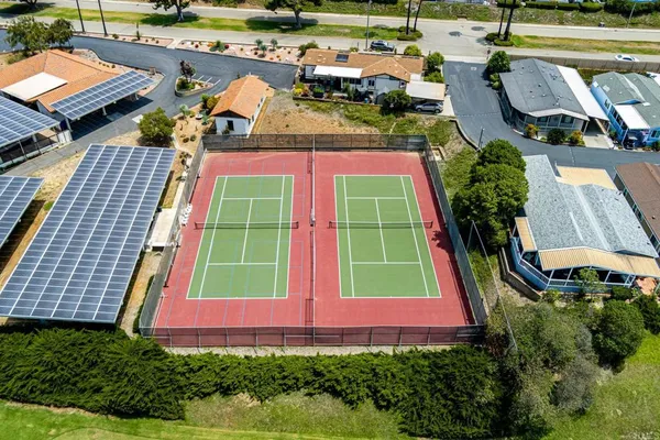 an aerial view of a house with a yard