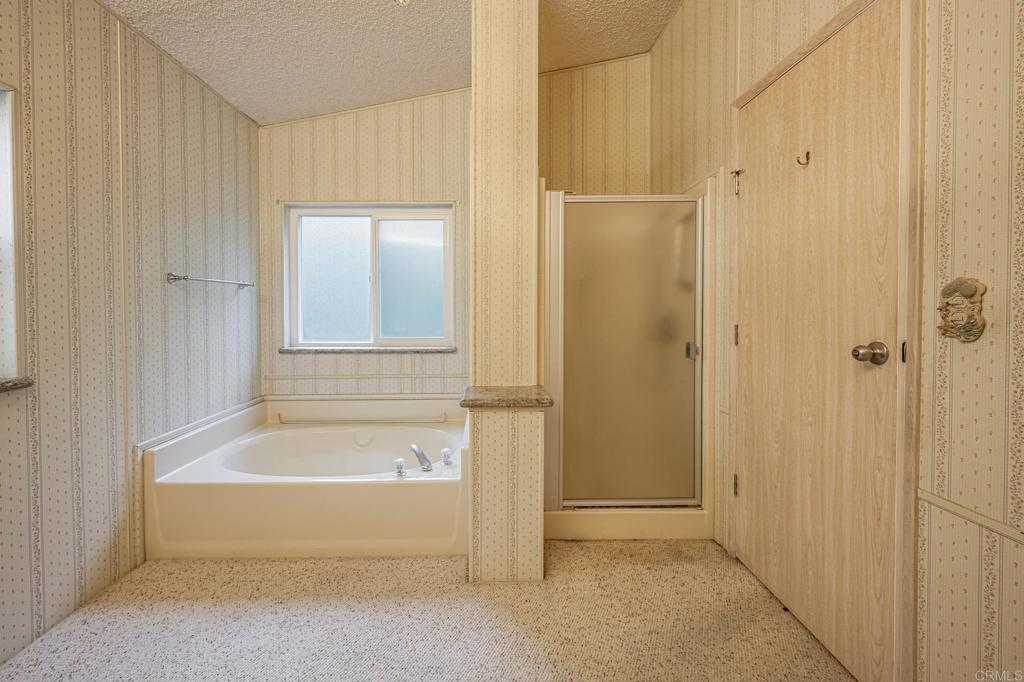 4650 Dulin Road, Unit 175 Fallbrook, CA 92003 - Photo 27 of 53 a bathroom with a bathtub and a shower
