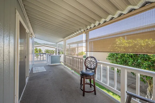 a view of balcony with wooden floor