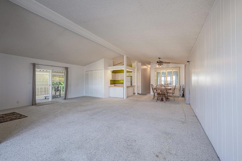 4650 Dulin Road, Unit 175 Fallbrook, CA 92003 - Photo 45 of 53 an empty room with windows and ceiling fan