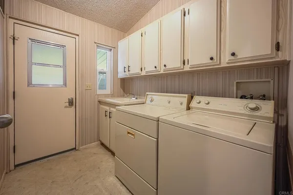 a view of a livingroom with a chandelier fan