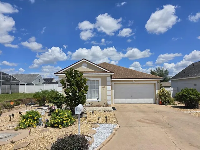 a view of a house with a flower garden