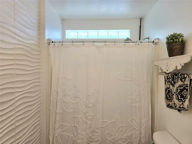a bathroom with a shower curtain
