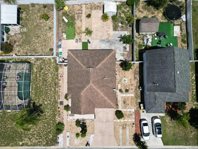 an aerial view of a house with outdoor space
