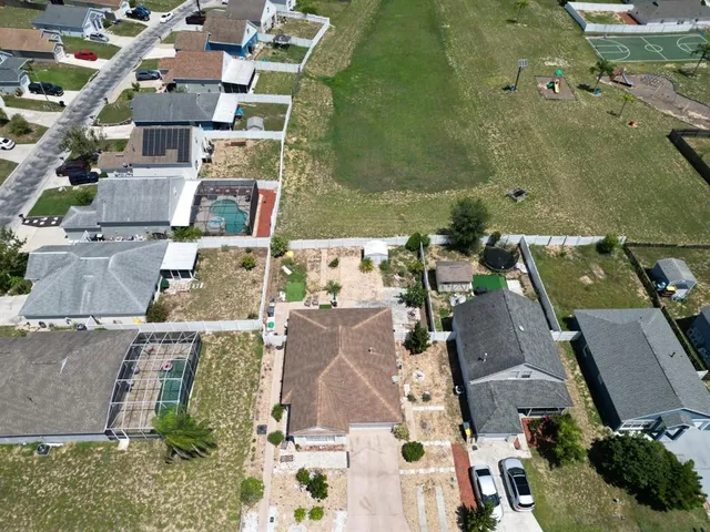 an aerial view of residential houses with outdoor space