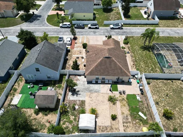 an aerial view of a house with a swimming pool