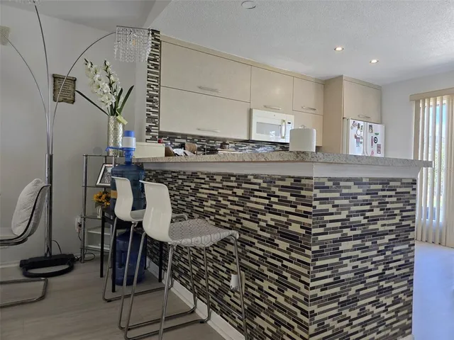 a bathroom with a mirror and a sink