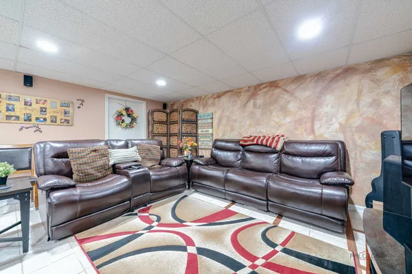 a living room with furniture and a rug