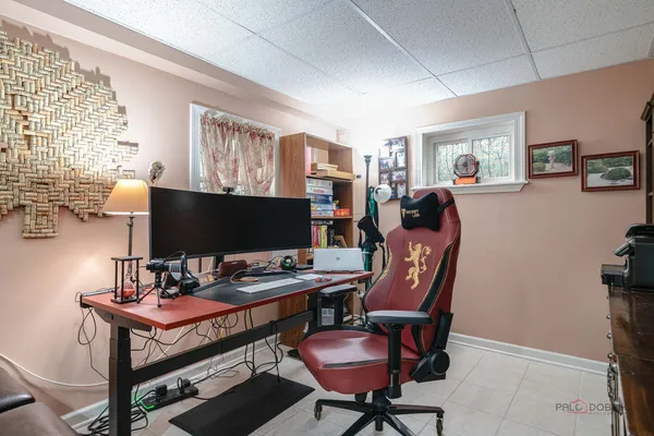 a reading room with furniture and a flat screen tv