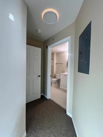 a view of a bathroom with a sink and a mirror