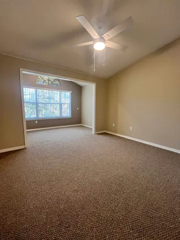 an empty room with a empty space and windows