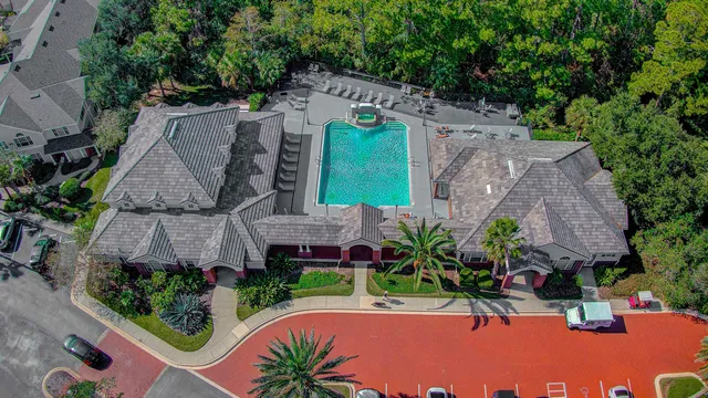 an aerial view of a house with a garden and plants
