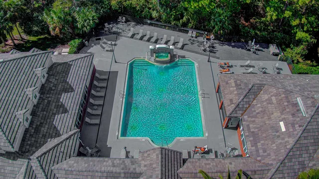 an aerial view of a house with outdoor space