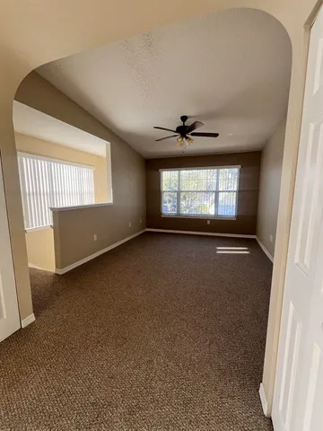 a view of an empty room with a window