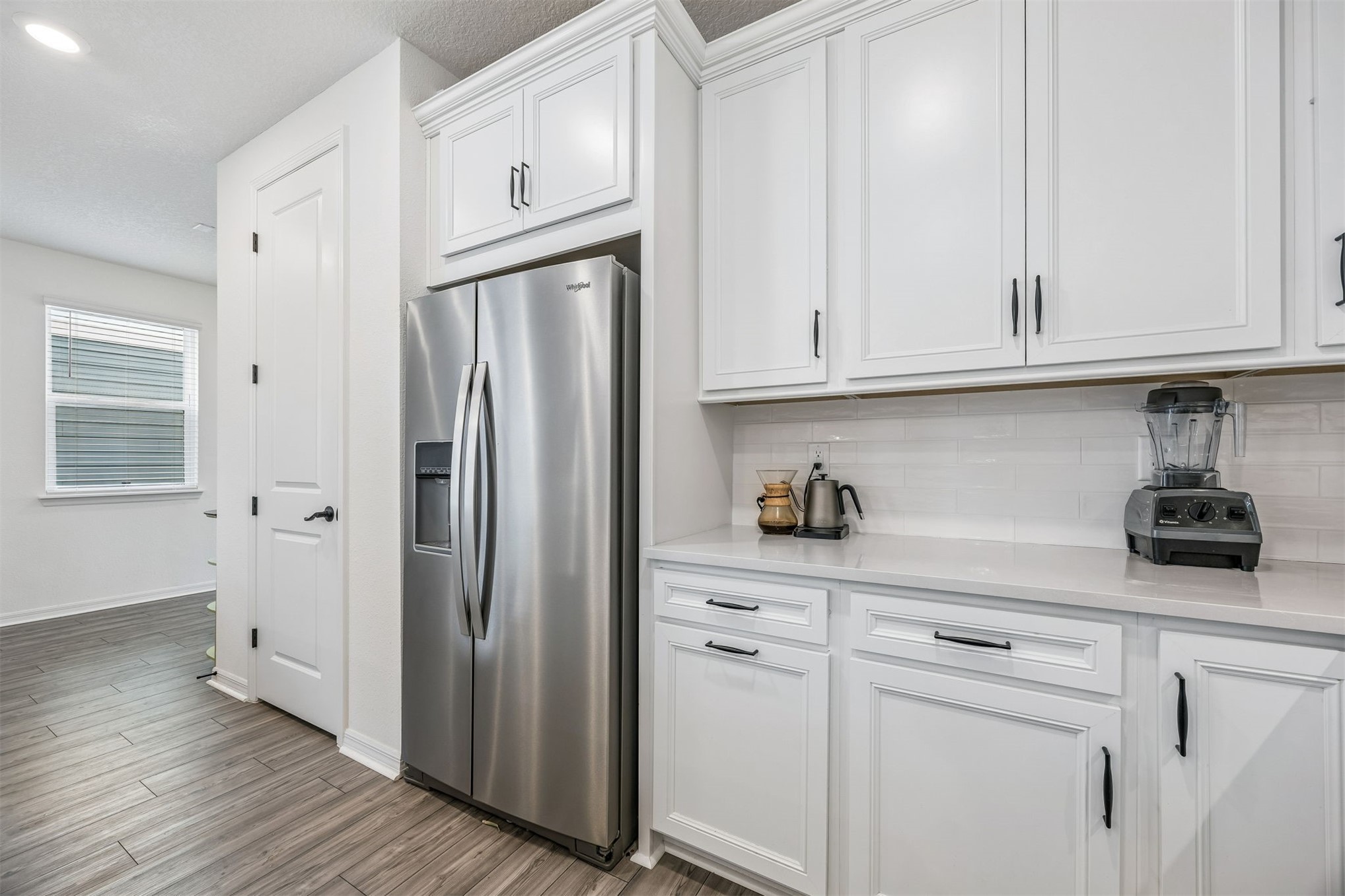236 Hawthorn Park Circle Yulee, FL 32097 - Photo 9 of 28 a kitchen with stainless steel appliances white cabinets and a sink