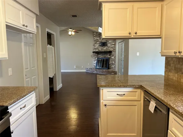 a kitchen with a sink and a refrigerator