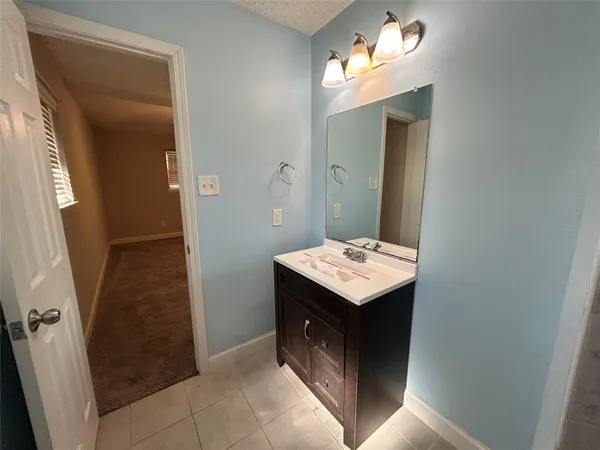 a bathroom with a sink and mirror