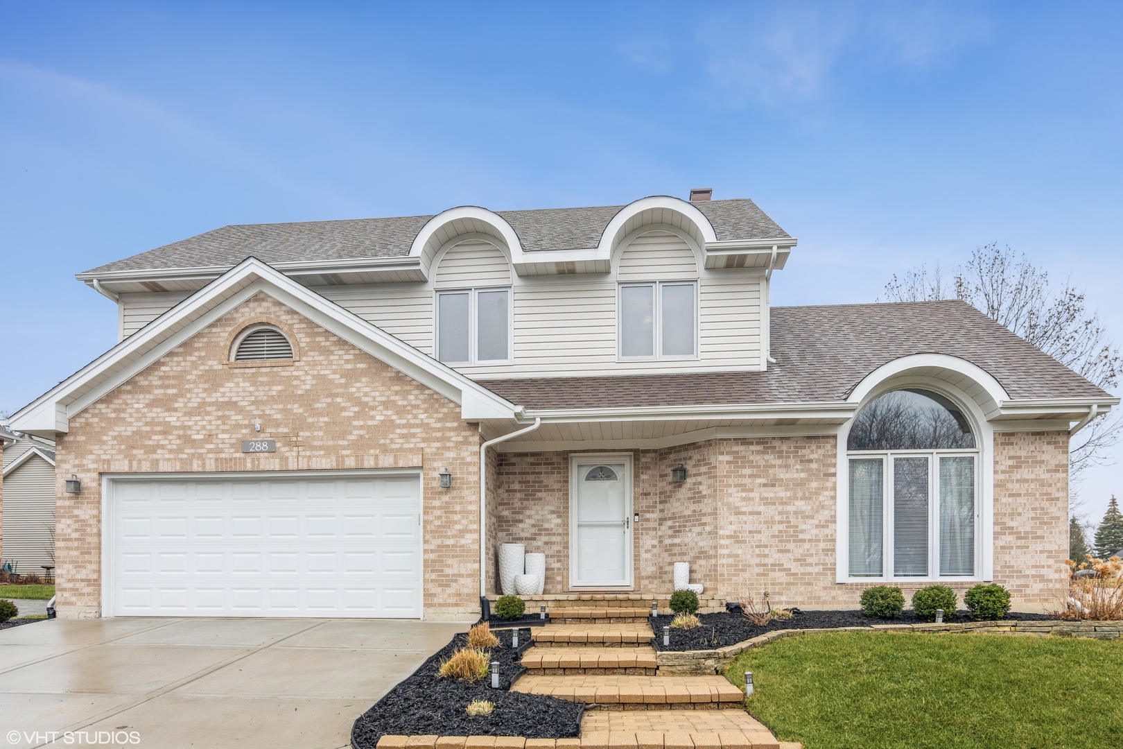 288 Windsor Drive Bartlett, IL 60103 - Photo 1 of 24 a front view of house with yard
