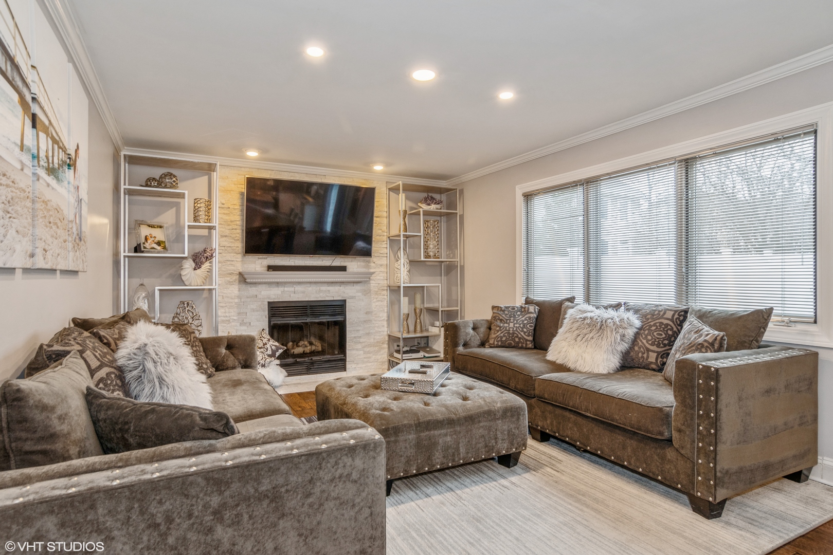 288 Windsor Drive Bartlett, IL 60103 - Photo 11 of 24 a living room with furniture a fireplace and a flat screen tv
