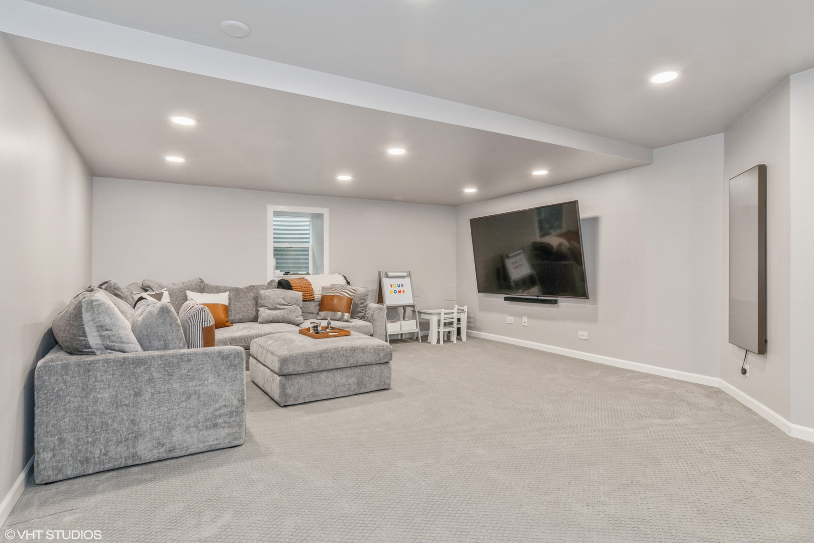 288 Windsor Drive Bartlett, IL 60103 - Photo 20 of 24 a living room with furniture and a flat screen tv