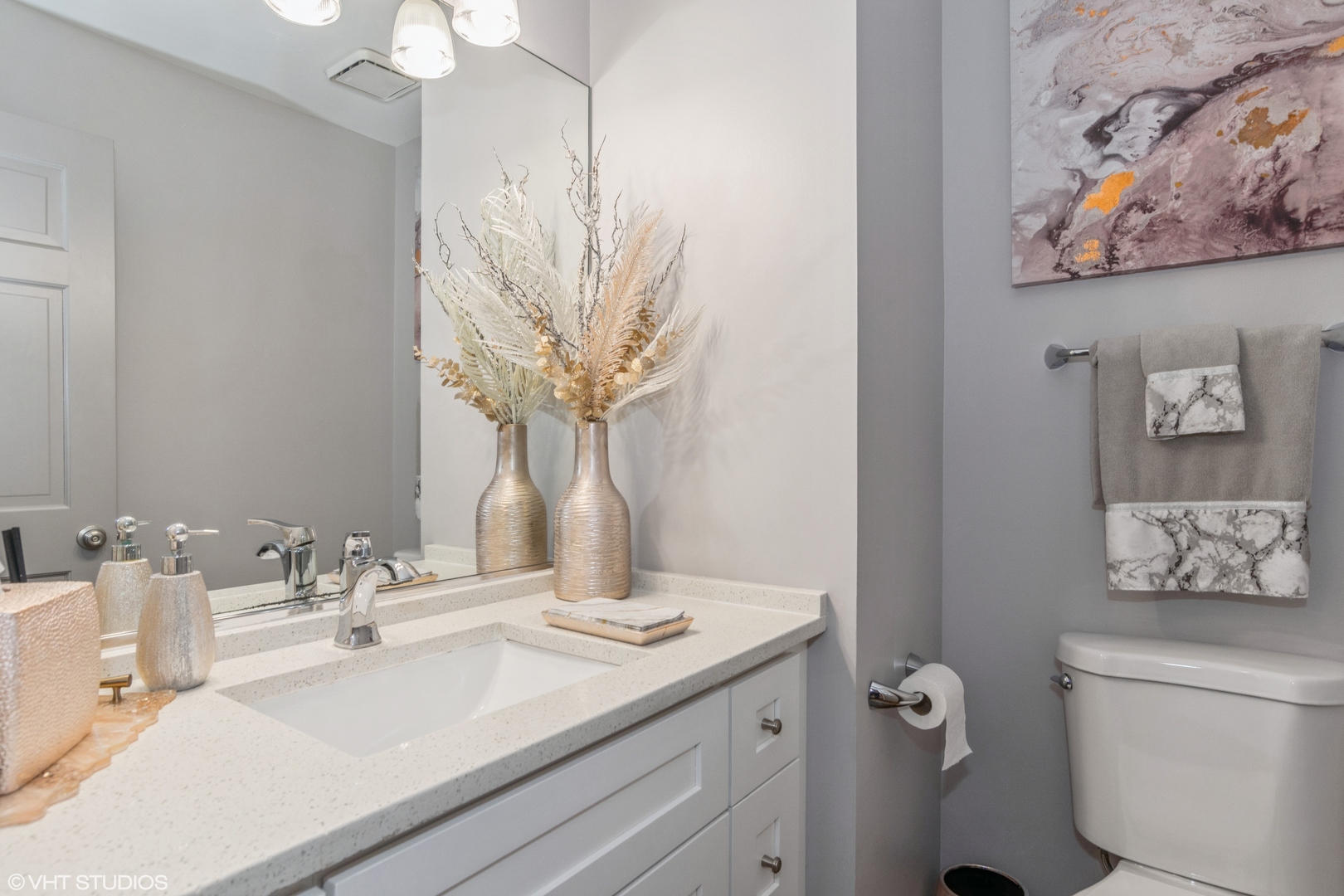 288 Windsor Drive Bartlett, IL 60103 - Photo 22 of 24 a bathroom with a sink a toilet and a mirror