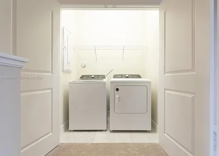a utility room with dryer and washer