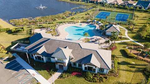 a aerial view of a house with a yard