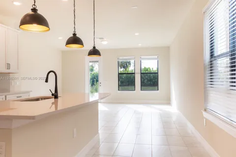 a kitchen with a sink and a window