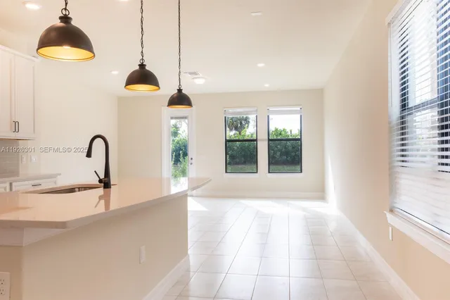 a kitchen with a sink and a window