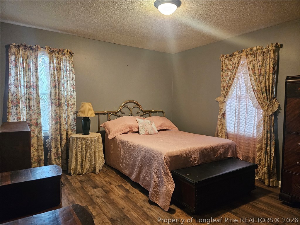 4547 Legion Road Hope Mills, NC 28348 - Photo 23 of 28 a bedroom with a bed and a window